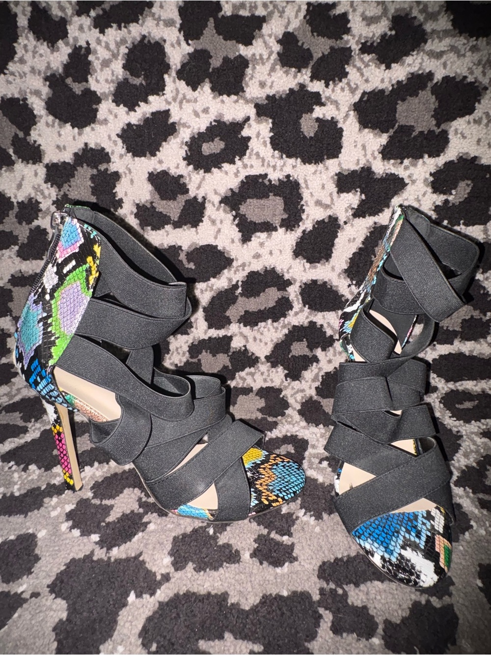 Strappy snakeskin heels.
